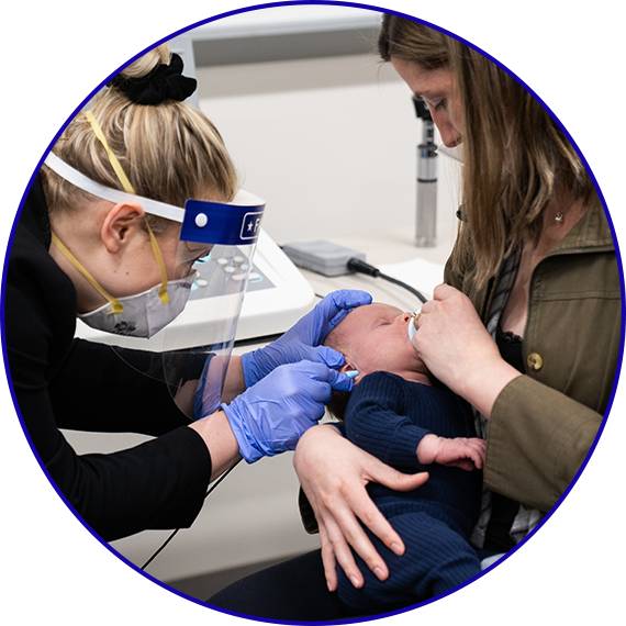 Students working with an infant SP